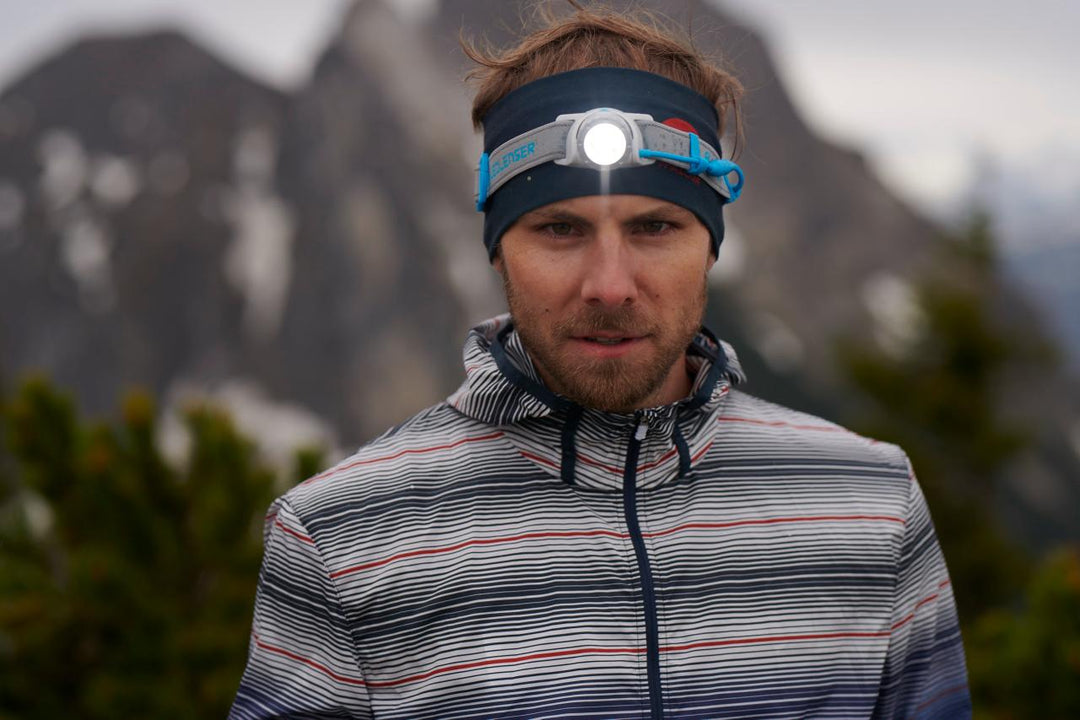 Runner wearing Ledlenser head torch in alpine conditions — Ledlenser NZ at Dwights