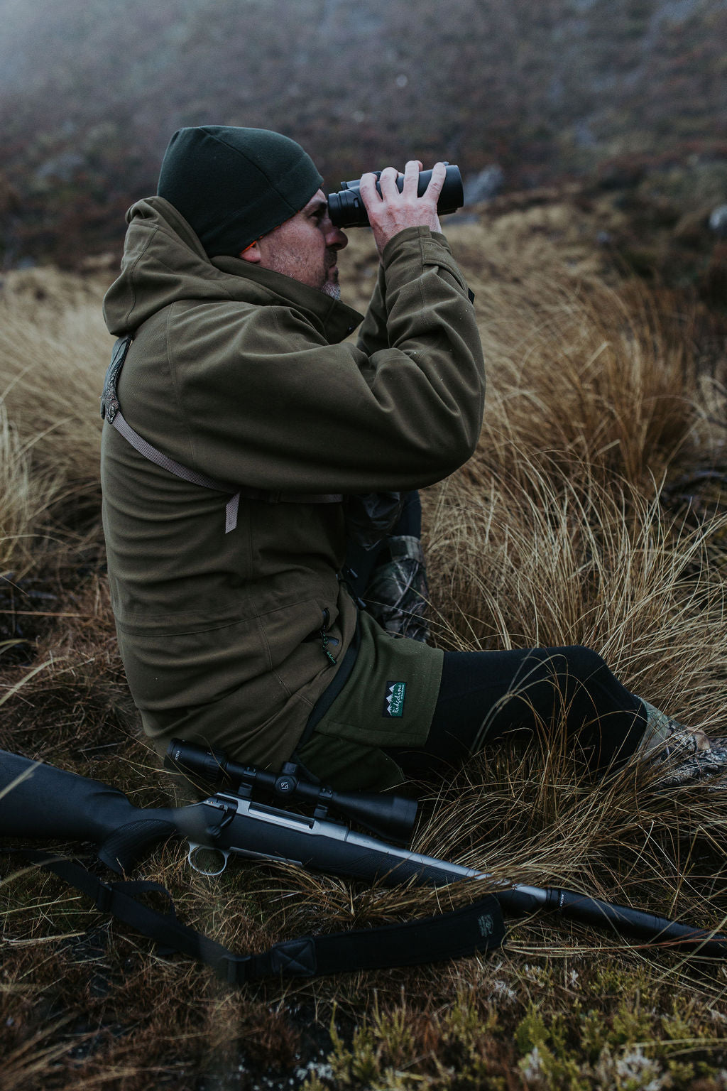 man using binoculars