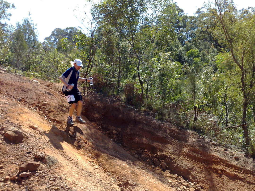 Trail runner on a rocky mountain trail in New Zealand
