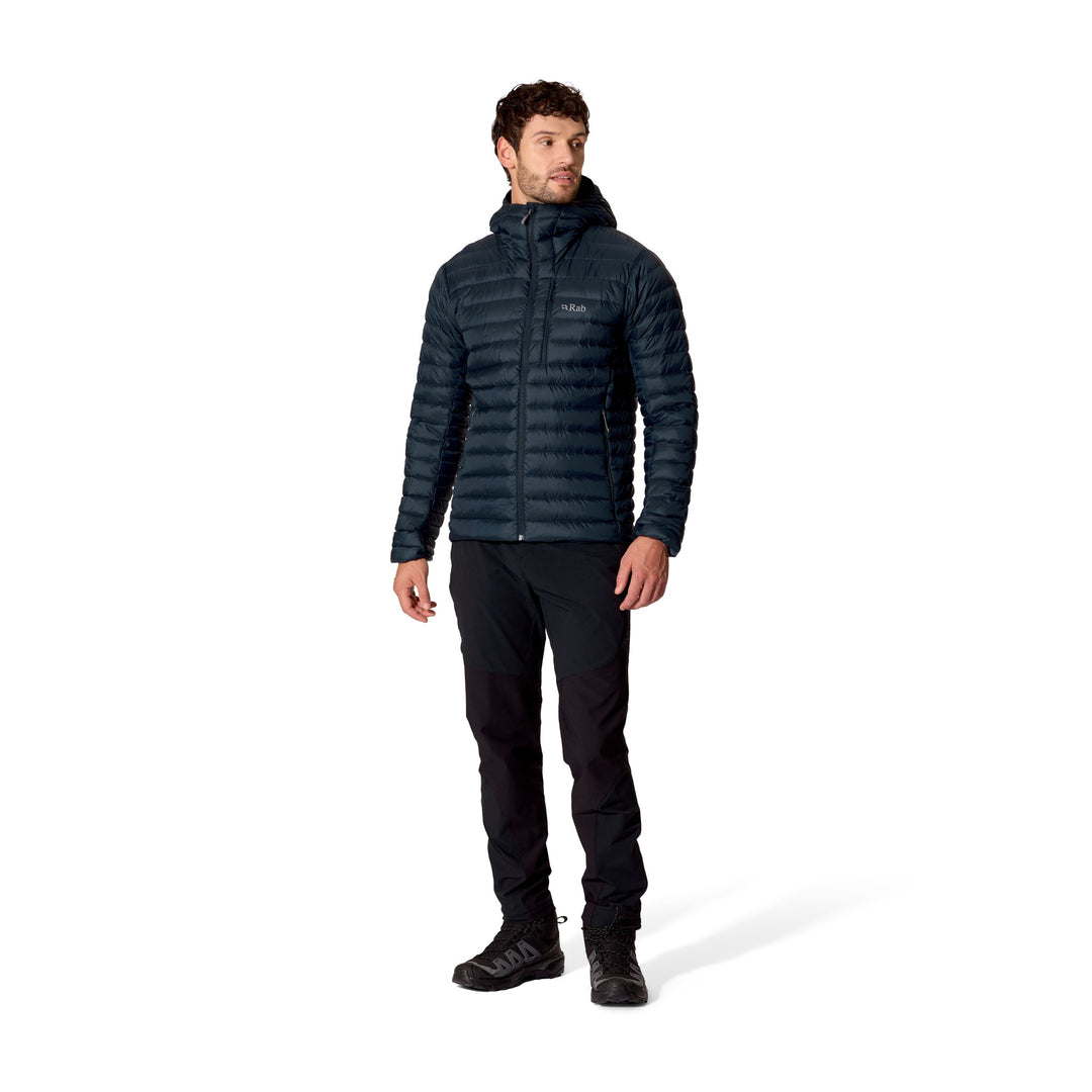Full-length front view of a man wearing the Rab Microlight Alpine Down Hoody in Galaxy Blue.