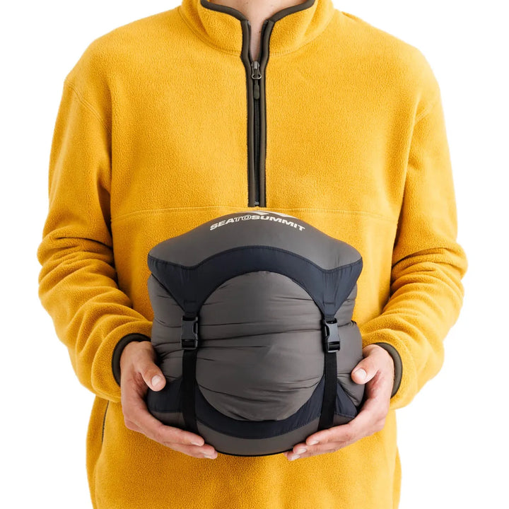 Sea to Summit Spark Down Sleeping Bag −18°C – packed size shown in hand